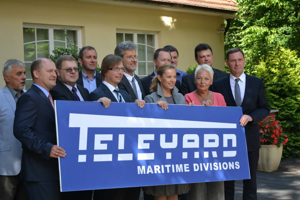 Baner Teleyard trzymają: Prezydent Szczecina Piotr Krzystek, Wiceprezes KSSSE Roman Dziduch, Christopher Maas, Posłanki na Sejm RP Renata Zaremba i Magdalena Kochan oraz Wicemarszałek Andrzej Jakubowski